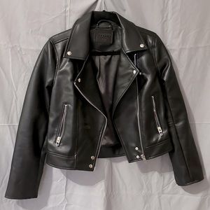 BlankNYC black vegan leather motto jacket.